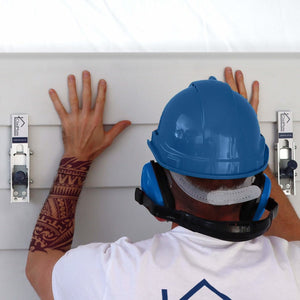 Carpenter Using CladMate Weatherboard Clamps